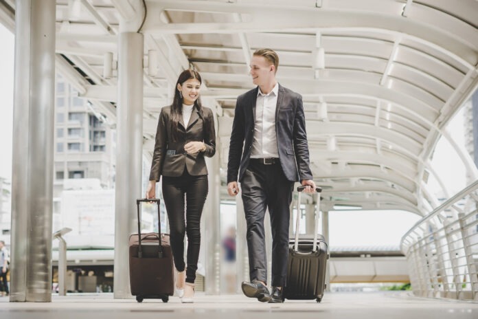 business-man-and-woman-are-going-on-business-trip