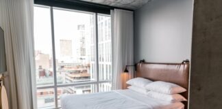 white bed linen on bed