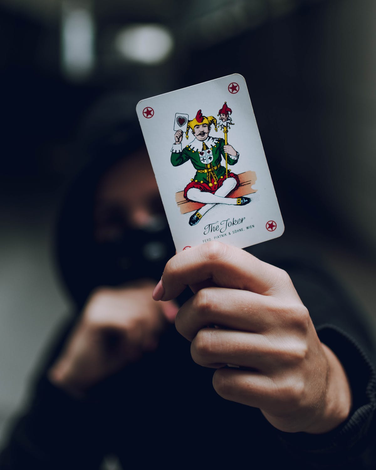 A person holding a card Description automatically generated with medium confidence