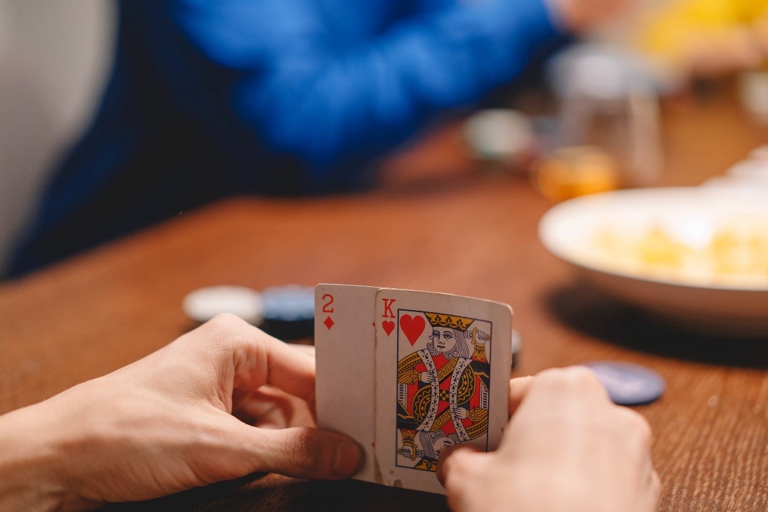 A person holding a card Description automatically generated with low confidence