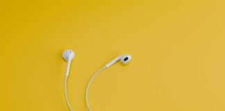 Apple EarPods on yellow surface