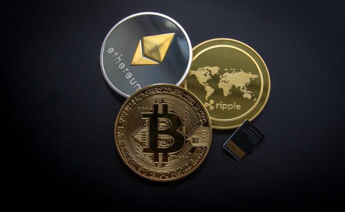 Free Ripple, Etehereum and Bitcoin and Micro Sdhc Card Stock Photo