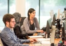 unknown persons using computer indoors