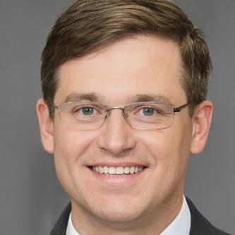 A person wearing glasses Description automatically generated with medium confidence