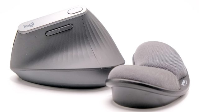a close up of a pair of shoes next to a speaker