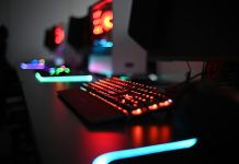 a computer keyboard sitting on top of a desk